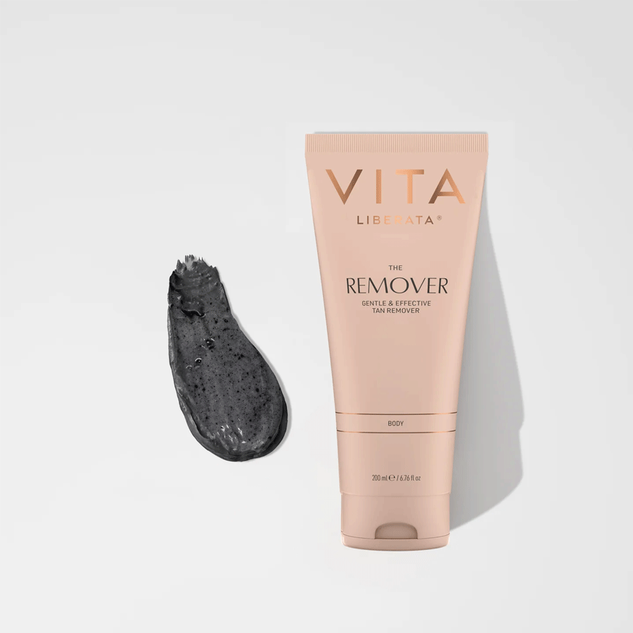 Rose gold tube of Vita Liberata The Remover 200ml with dark gray textured product swatch beside it on white background