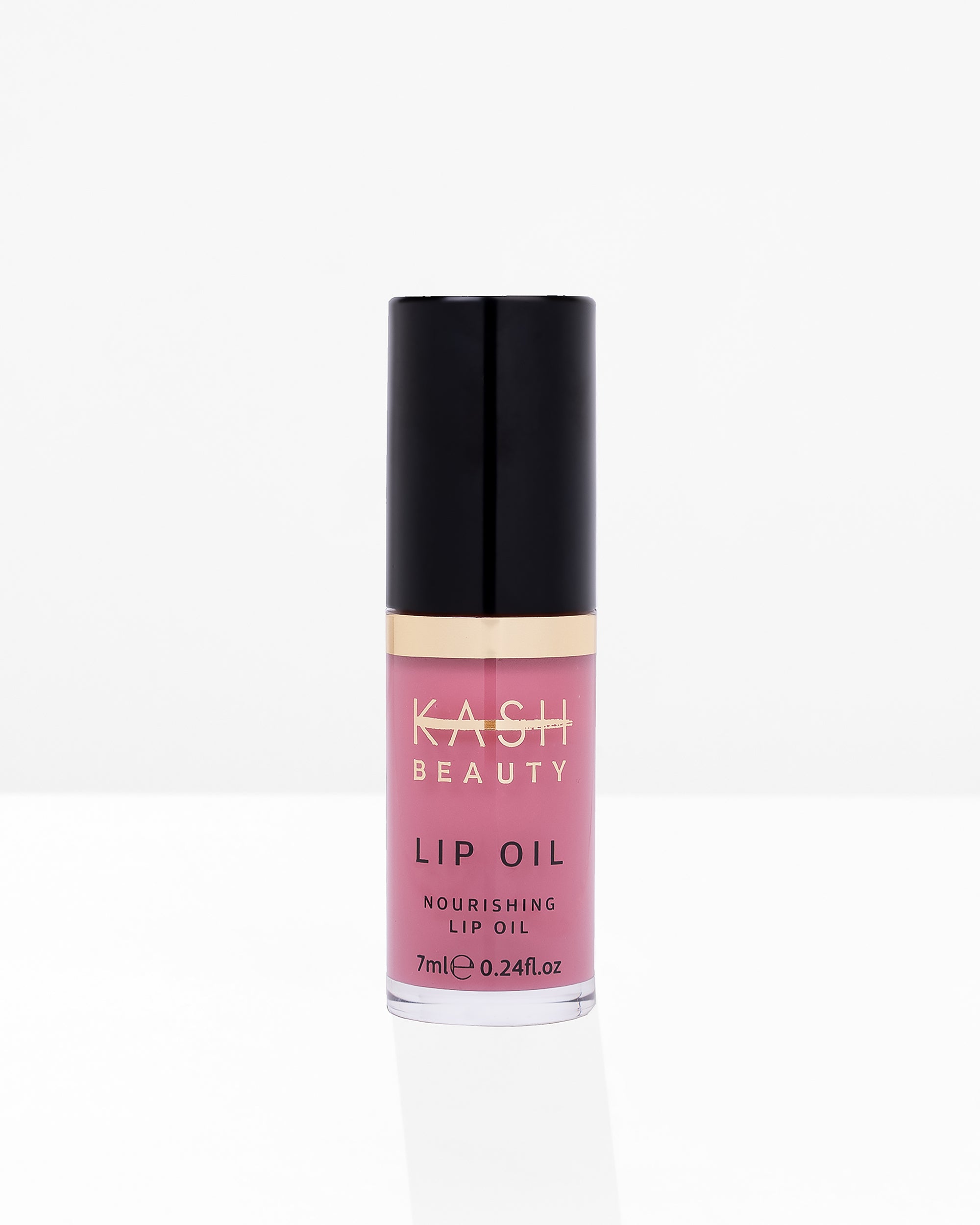 Pink nourishing lip oil in clear glass bottle with black cap and gold band, by KASH Beauty, front view on white background