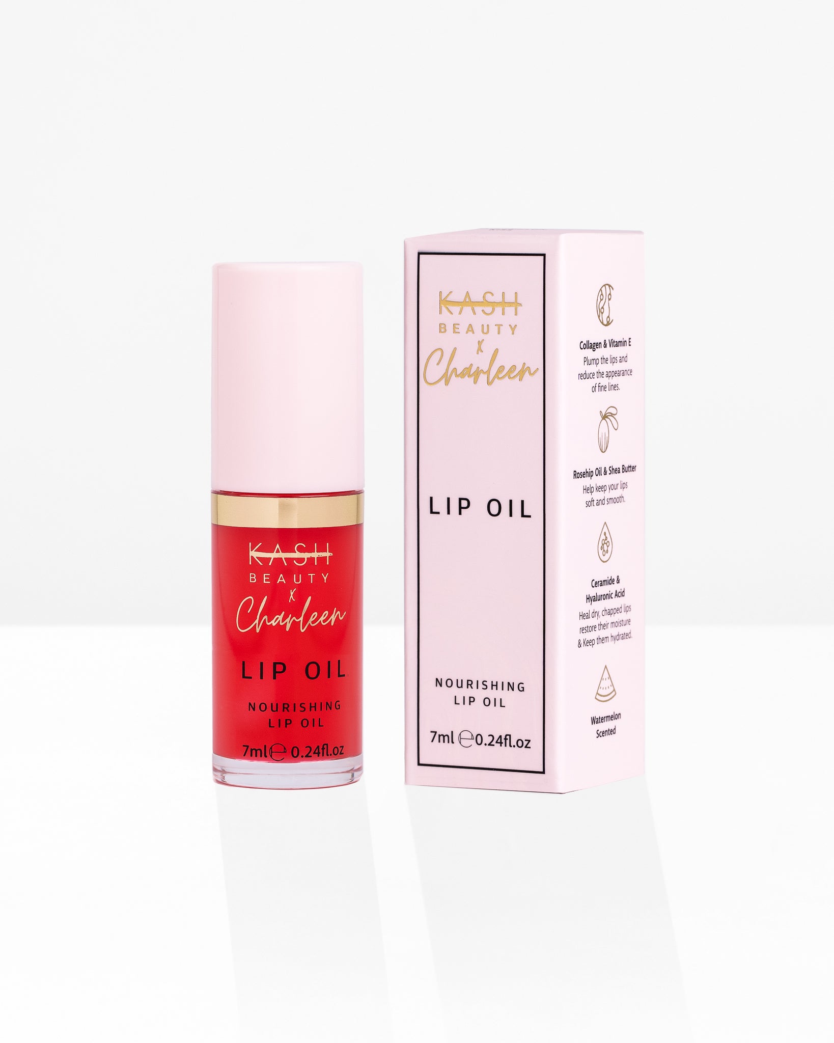 Red nourishing lip oil with gold band and pink cap by KASH Beauty, shown with matching pink box featuring gold text and watermelon scent icon.