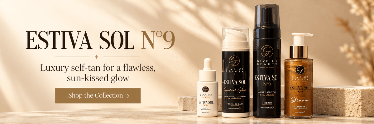 A promotional banner for Estiva Sol No. 9 self-tan products, featuring several bottles and jars of various sizes on a light beige surface with a warm, sunlit background.