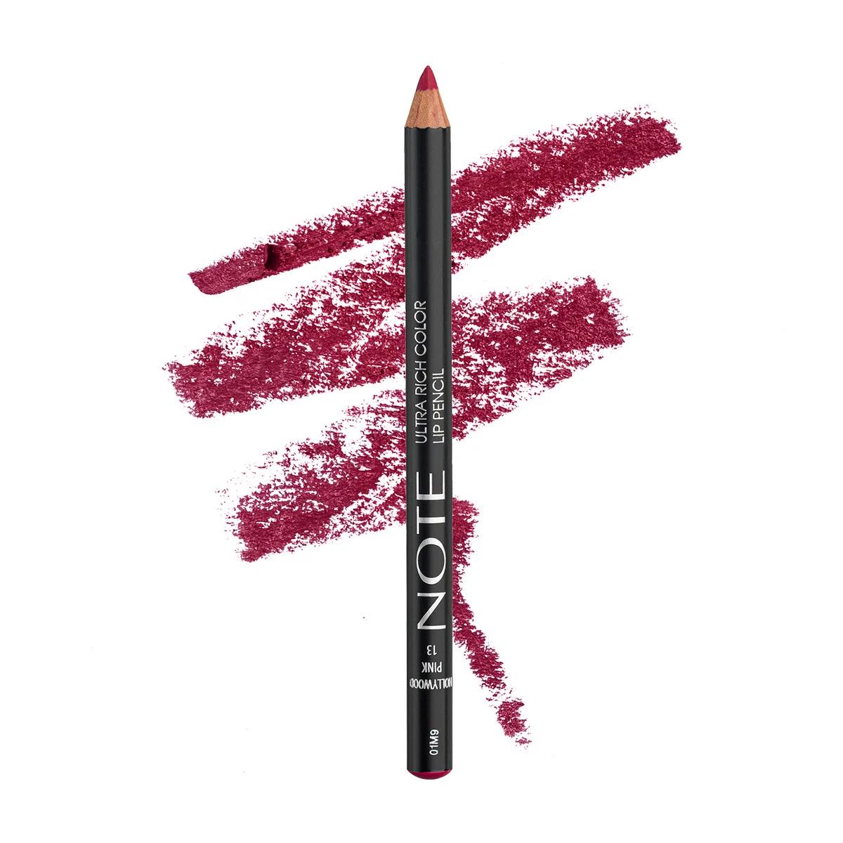 A single lip pencil from the brand NOTE, shown vertically against a white background with three textured swatches of the deep berry-red formula behind it. The pencil is black with white text and the tip is colored in the matching deep berry-red shade.
