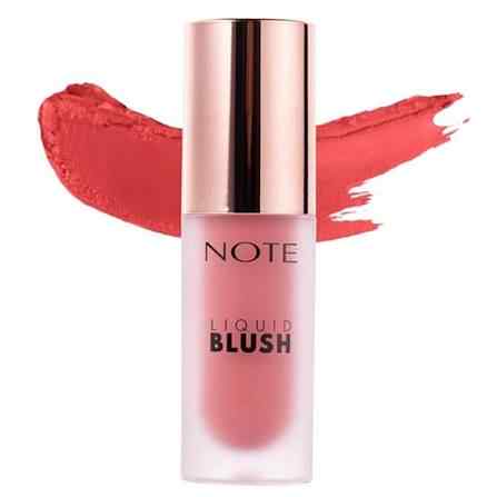 A bottle of NOTE Liquid Blush in a coral pink shade, featuring a metallic rose gold cap and a matching coral pink product smear behind it on a white background.
