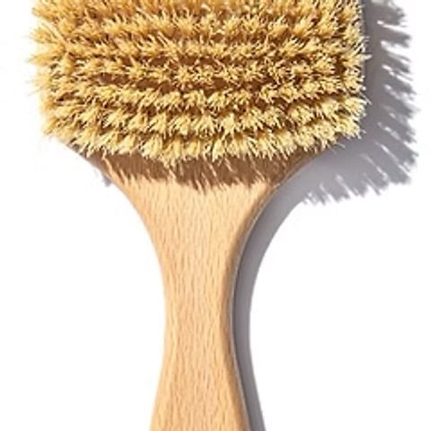 Bare Naked Dry Body Brush with natural vegan bristles for exfoliating and smoothing skin.
A close-up of a natural wood body brush with dense golden-tan bristles and a light wood handle, shown against a white background with a soft shadow.
