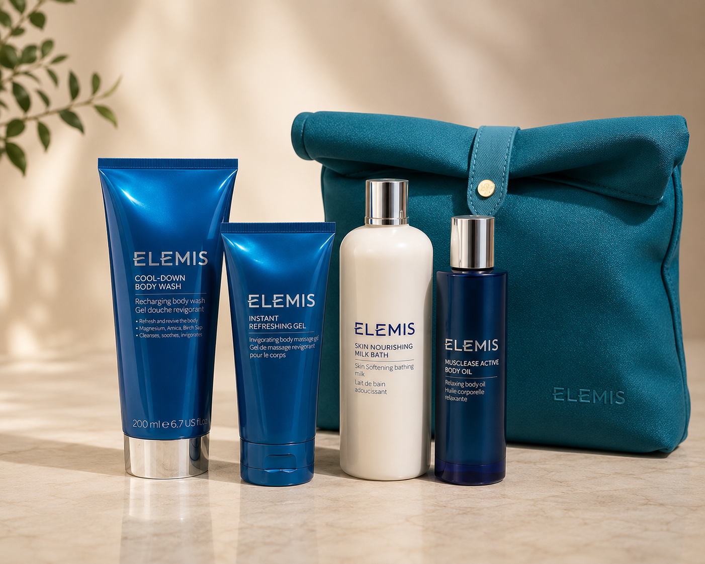 Elemis skincare products including bottles and tubes with a teal bag on a beige background.