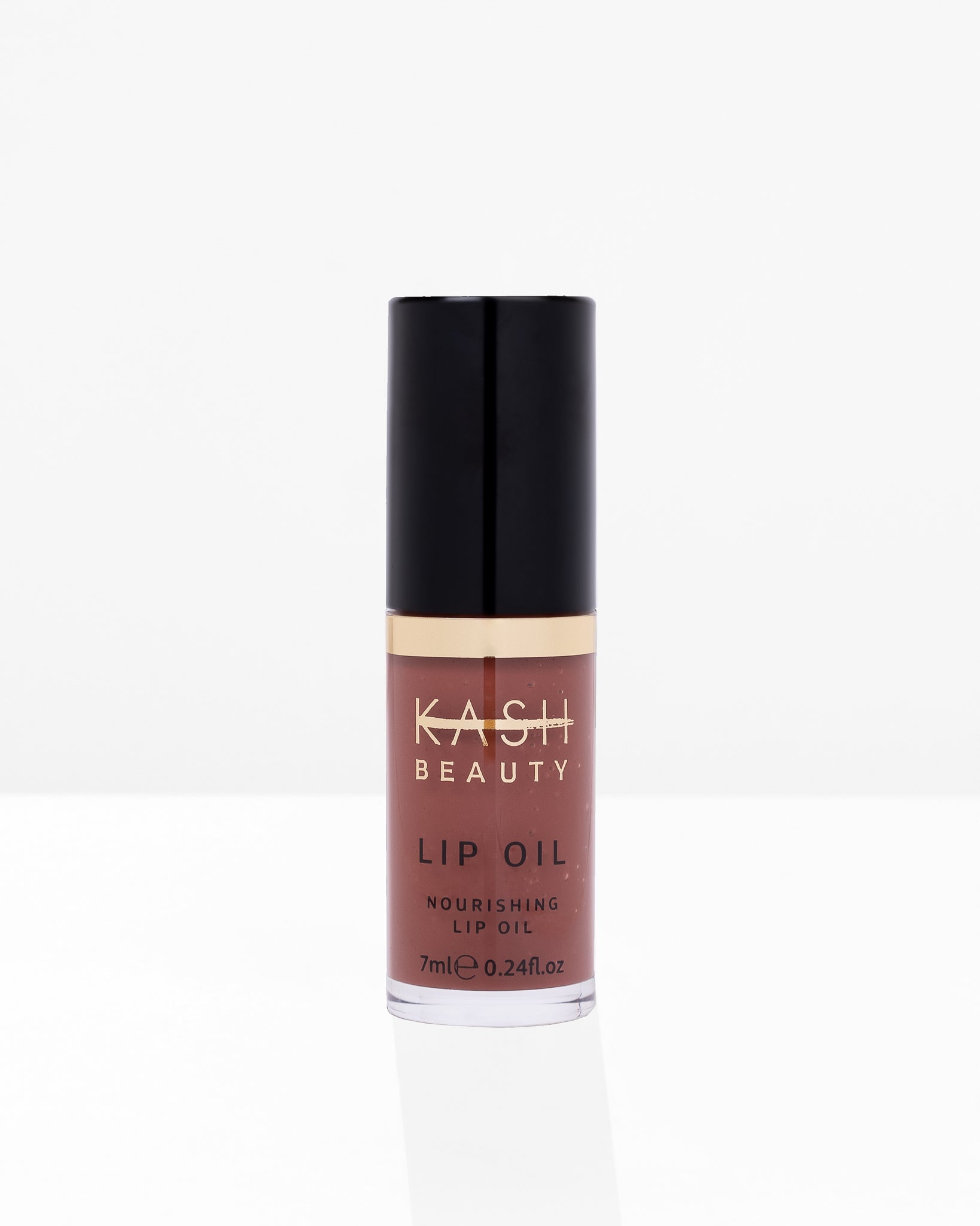 Nourishing brown lip oil by KASH Beauty with gold band and black cap, front view on white background