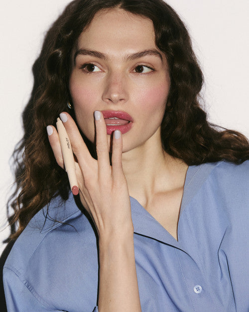 Inglot Tinted Lip Balm hydrating peptide lip balm with personalised natural tint. woman wearing the inglot lip balj
