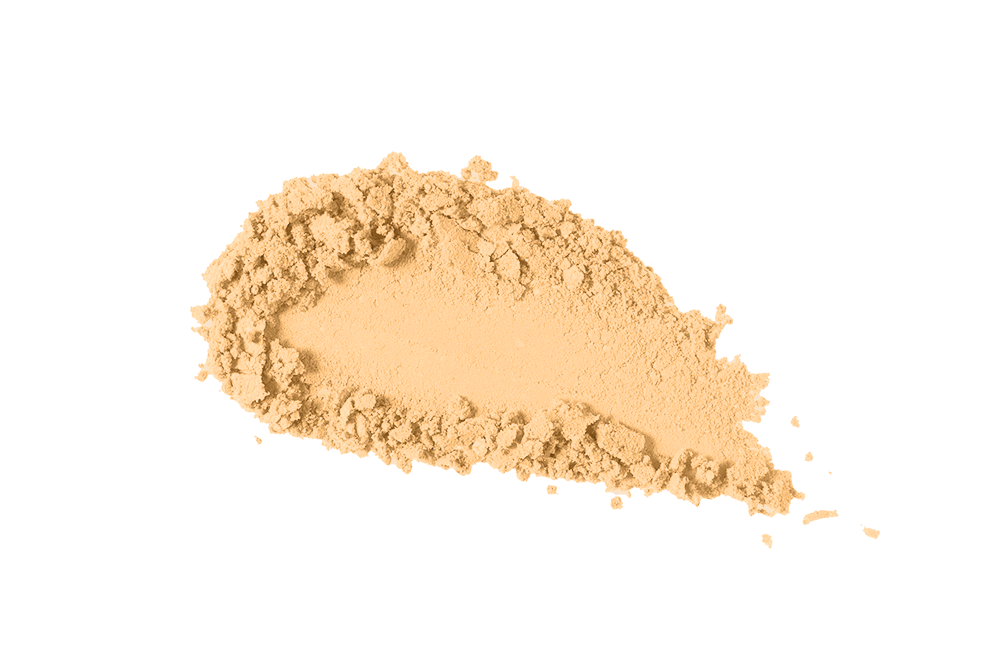 Light beige loose powder by KASH Beauty, finely milled with soft, airy texture, shown in a scattered pile on white background.