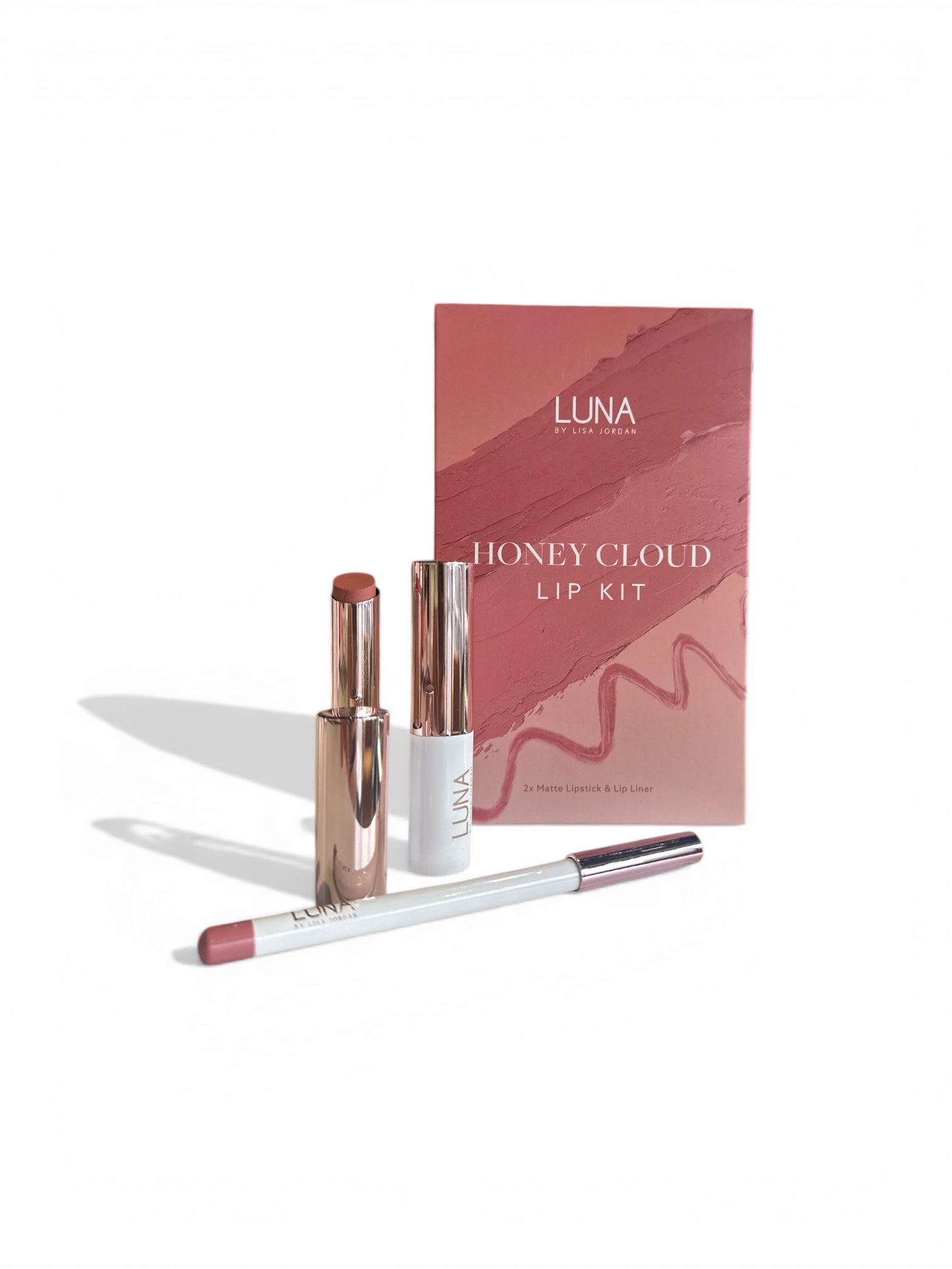 Luna Honey Cloud Lip Kit with lipsticks and a brush on a white background
