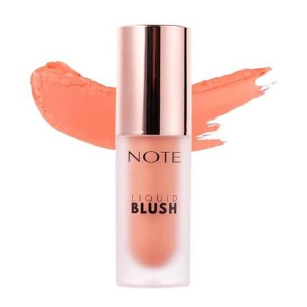 A bottle of NOTE Liquid Blush in a peachy coral shade, featuring a metallic rose gold cap and a matching peachy coral makeup swatch behind it on a white background.