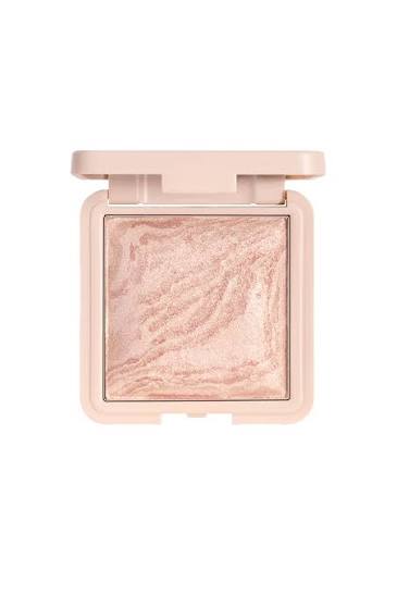 Note marble backed blusher. A single-pan makeup compact with a shimmering light pink and gold marbled highlighter powder, shown open against a plain white background.