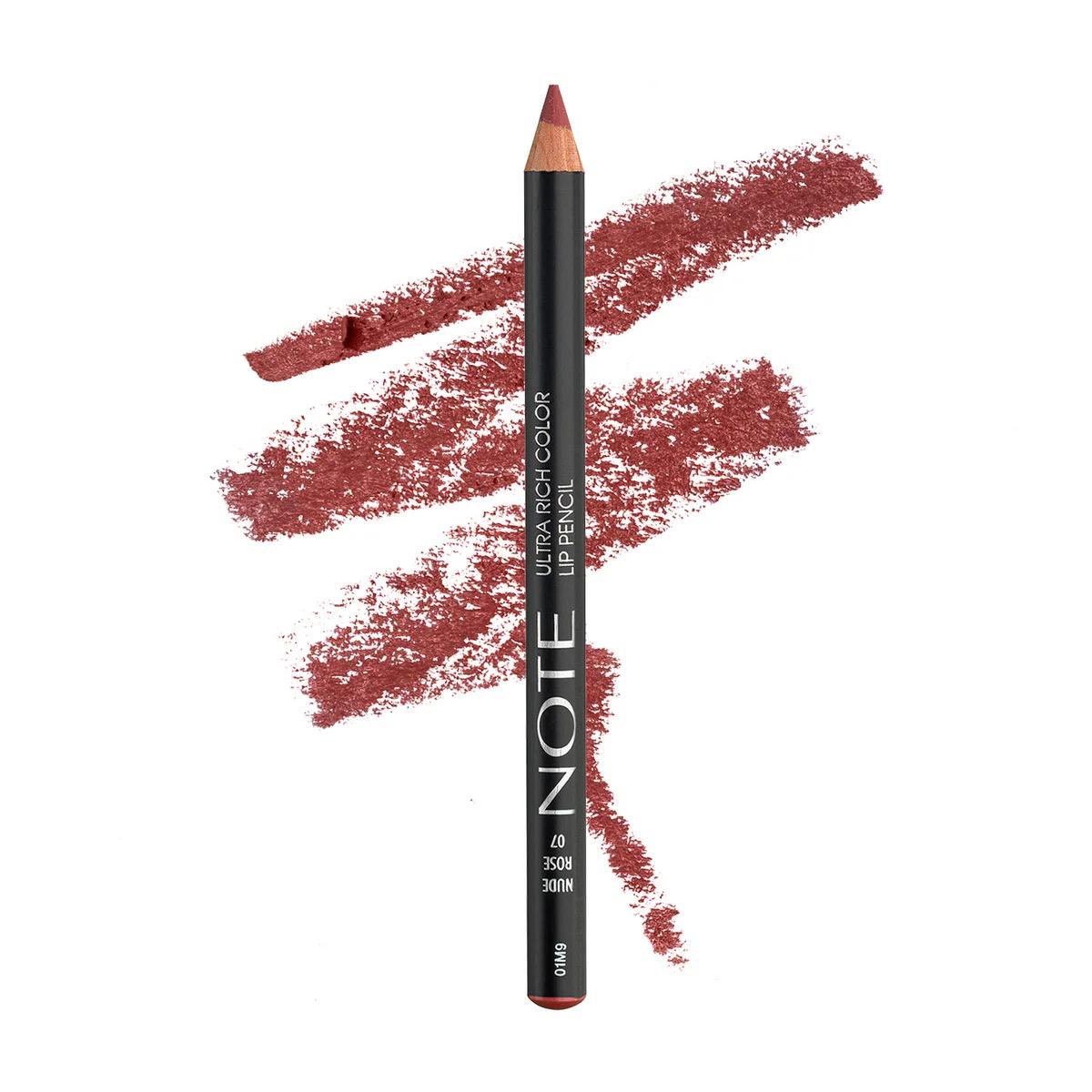 A black lip pencil with white text reading 'NOTE' and 'LIP COLOR LIP PENCIL' is shown upright in front of three diagonal swatches of a dusty rose-red lip color on a plain white background.